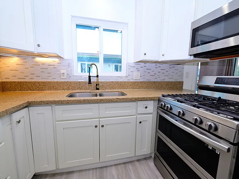 fully upgraded kitchen and in-unit laundry