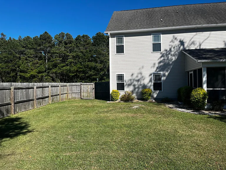 Expansive backyard with easy access to the rear of the home.