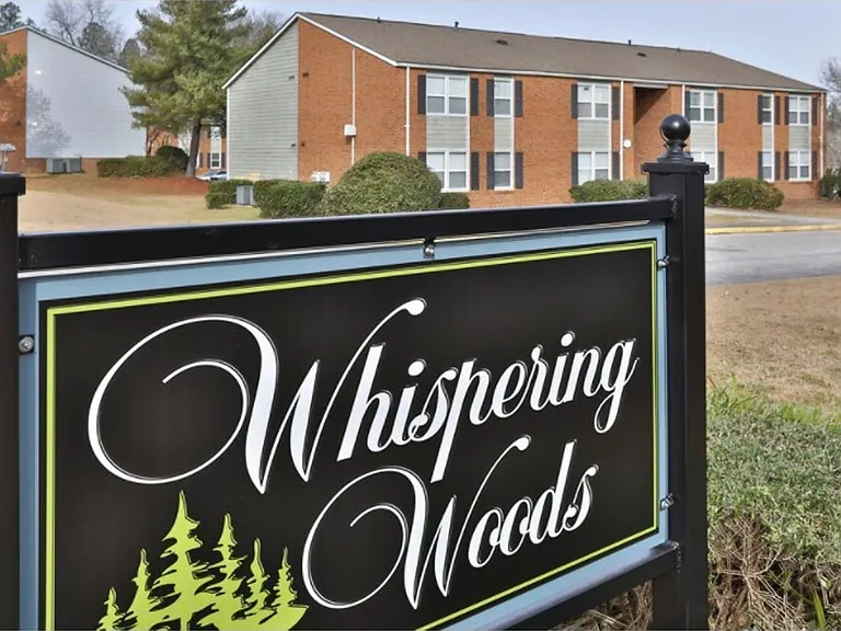 Whispering Woods Apartments — Photo 1