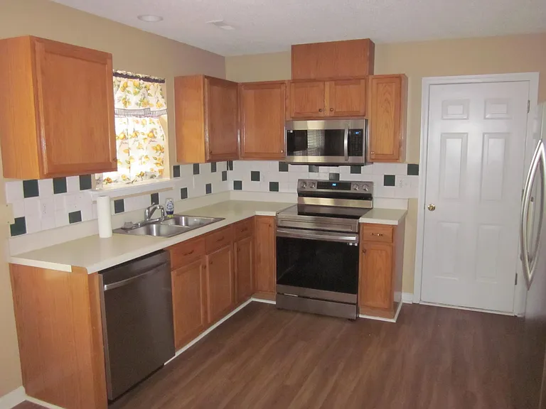 Large Kitchen with Stainless Steel appliances.