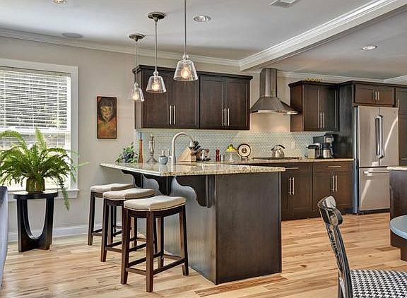 Fantastic cook's kitchen with ample storage and counter space. Breakfast bar is counter height - and
