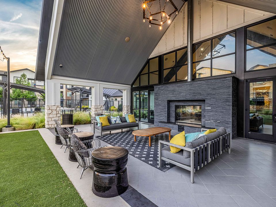 Outdoor Entertainment Lounge with Fireplace and TVs