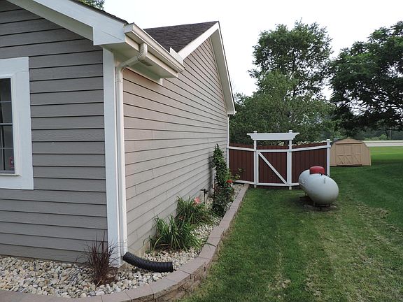 Side of the house and back side fence entry