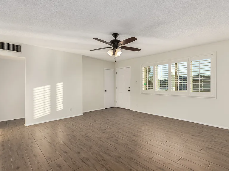 Wood looking tile floors in all common areas. Living Room area.
