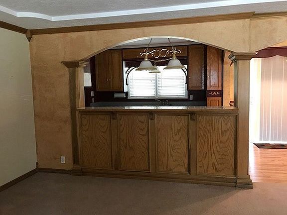 View from LR into kitchen and dining...perfect for a couple of bar stools for entertaining!