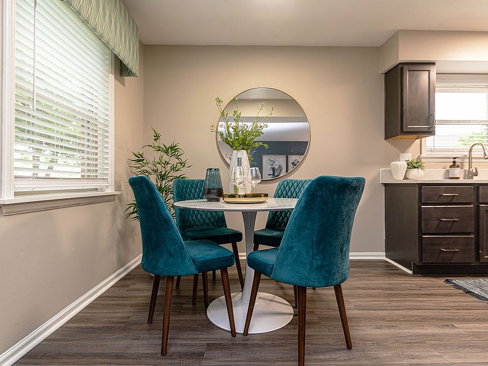Kitchen and dining area with hardwood-style flooring