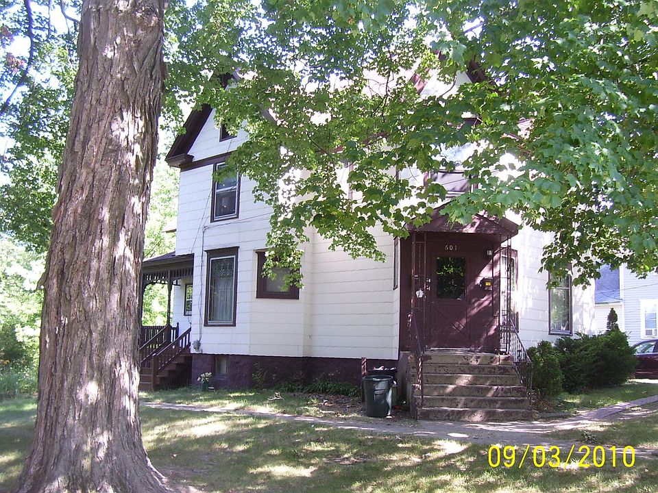 Large trees surround the property which is extra-wide and extra-deep.