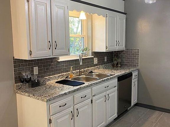 Updated kitchen with newer appliances and granite countertops