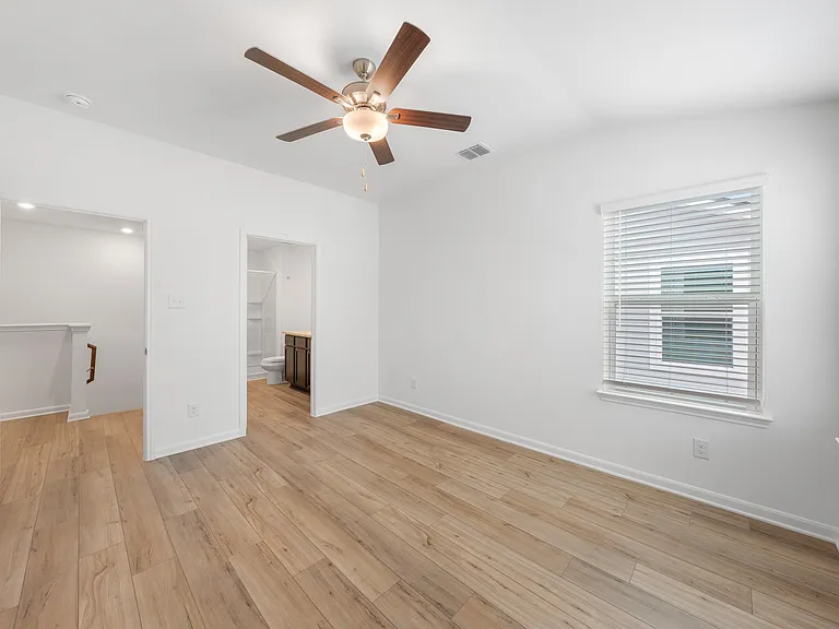 The master bedroom has its own bathroom and walk-in closet.