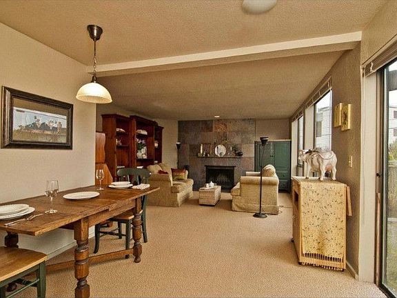 Generous dining space leads naturally to the living room area and the patio.