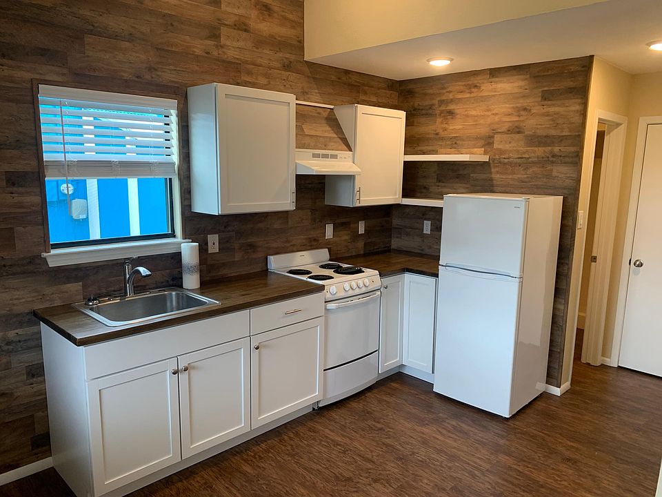New cabinets with butcher block countertops and plenty of storage space