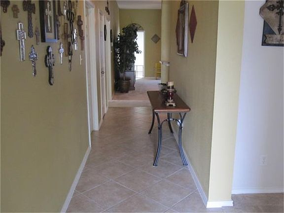 Enter to neutral decor, tile floors, formal dining room, spacious living which is open to the kitchen.
