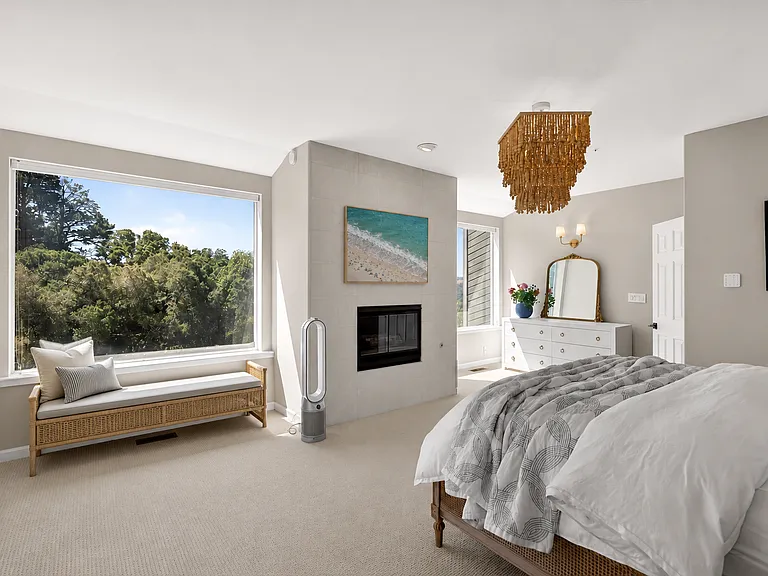 Primary bedroom with fireplace. Location: downstairs