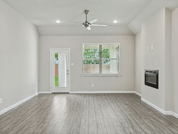 Living Room in the Pearl home plan by Trophy Signature Homes - REPRESENTATIVE PHOTO