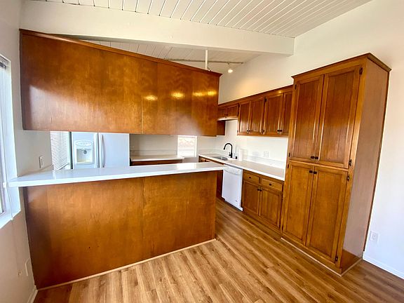 Looking into the kitchen. Lots of storage and brand new white quartz countertops