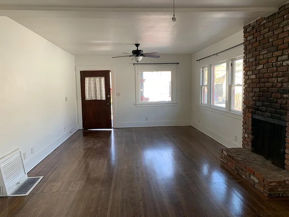 Open Living Room with lots of light and fan