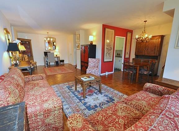 Bright and sunny large living room and "L" shaped dining room.  The living room overlooks the manicured courtyard and is 30'-2" x 12'-4" and the dining room is 9'-0" x 8'-5".