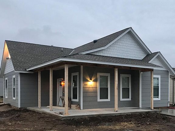 Front porch and entry door. We are wrapping the posts ASAP.