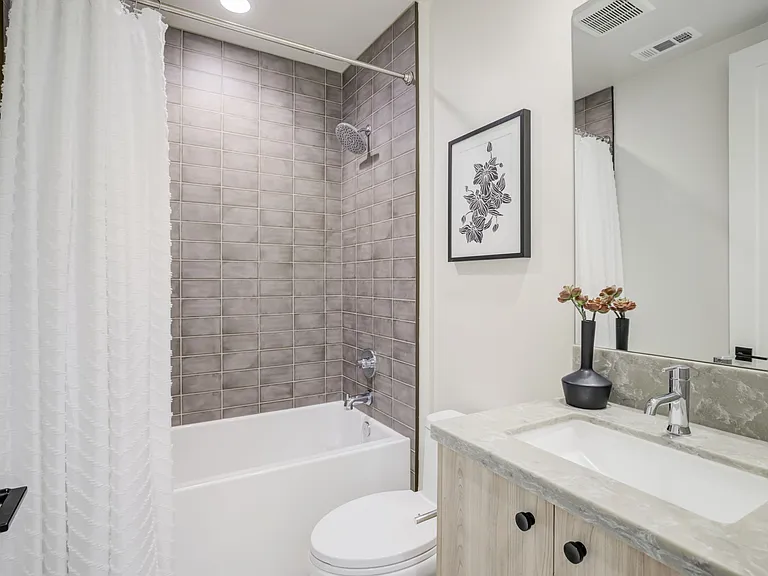 Third-floor full bathroom serving the secondary bedrooms, separate from the primary suite.