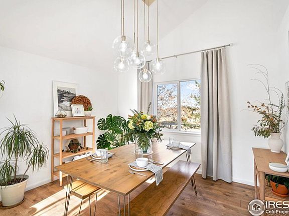 Dining area off kitchen with vaulted ceilings