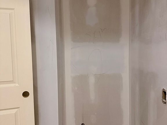 Half bathroom adjacent from Kitchen. New toilet, cabinet, floors and paint.