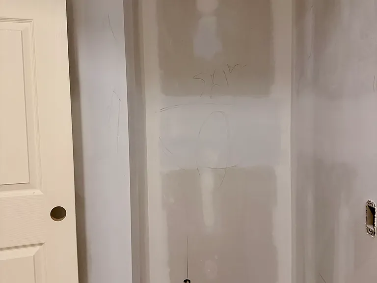 Half bathroom adjacent from Kitchen. New toilet, cabinet, floors and paint.