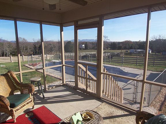 Screened in porch overlooking Inground Pool