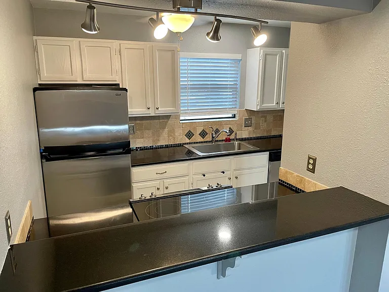 Breakfast bar to the kitchen.