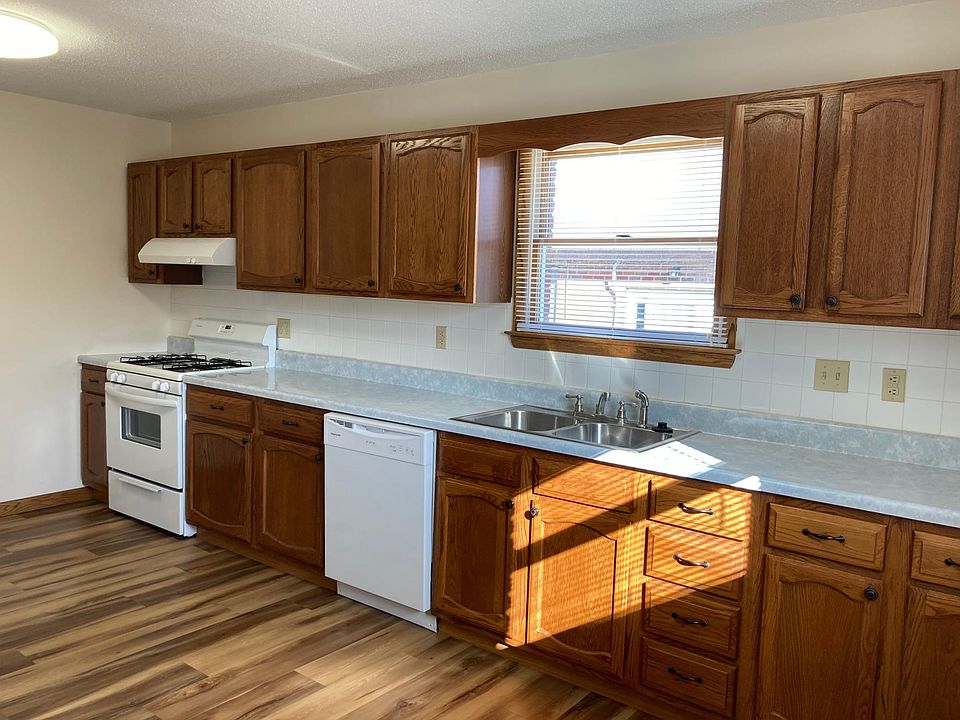 Large kitchen with dishwasher and garbage disposal.