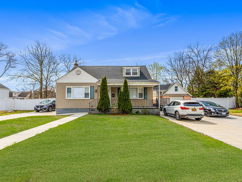 Exterior with driveway with 2 parking spots