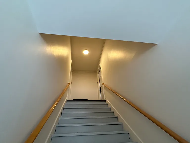Shared stairway to the two upstairs apartments
