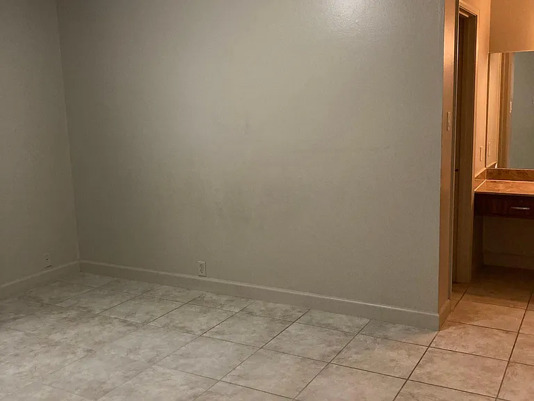 Primary suite includes a walk-in closet and private full bath, providing ample storage and a functional layout designed for everyday comfort.