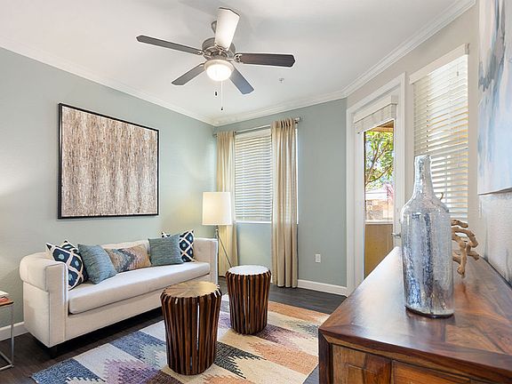 Apartment Living Room with wood-style flooring and patio.
