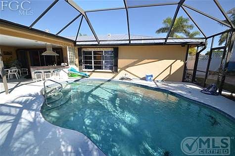 Screened Pool and outdoor kitchen.
