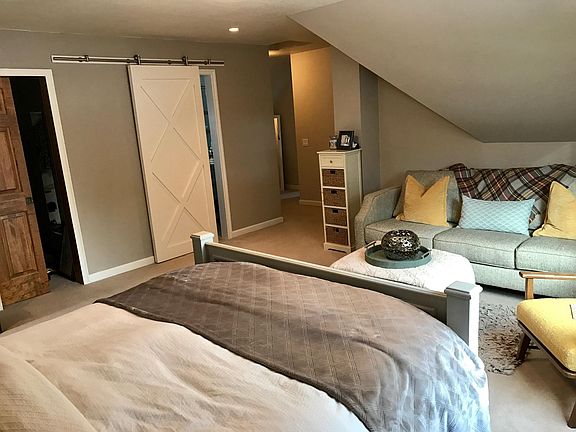 Master bedroom and sliding barn door on bathroom