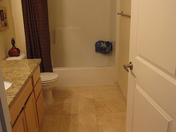 Travertine tile floors & granite countertop