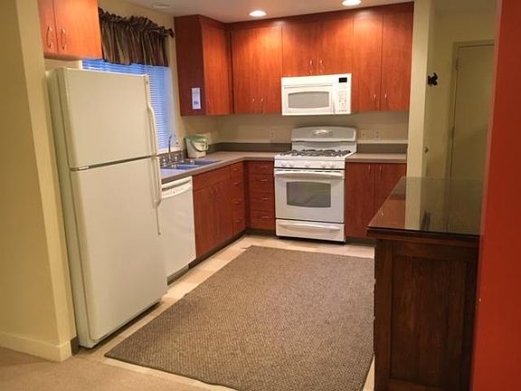 Kitchen with entry door at right.