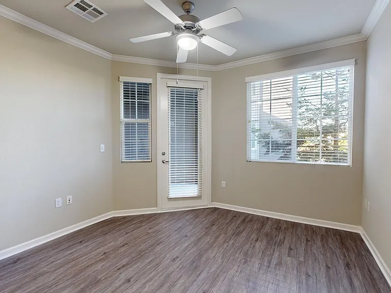 Apartment living room with wood-style flooring.