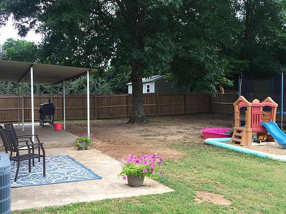 Covered patio & storage bldg