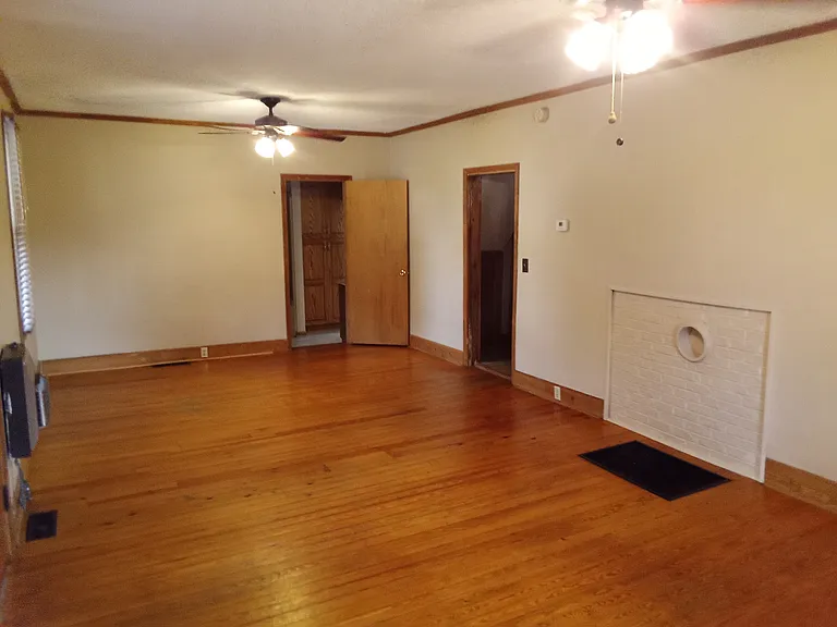 living/dining area. right door leads to kitchen open door leads to bathroom