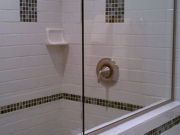 Subway tile shower with glass door
