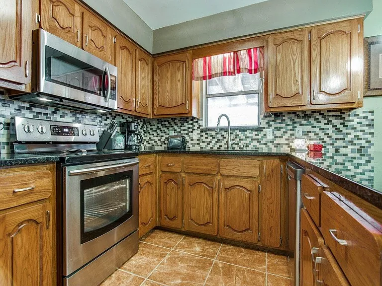 Modern and updated Kitchen with granite tops and stainless s