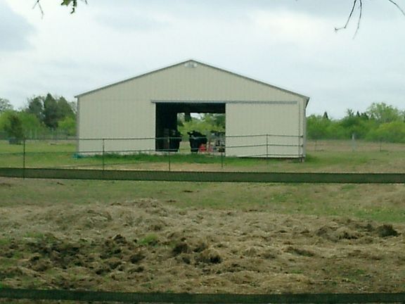 Barn has 20 Amp electric service, washer/dryer hookup, horse-safe feed room