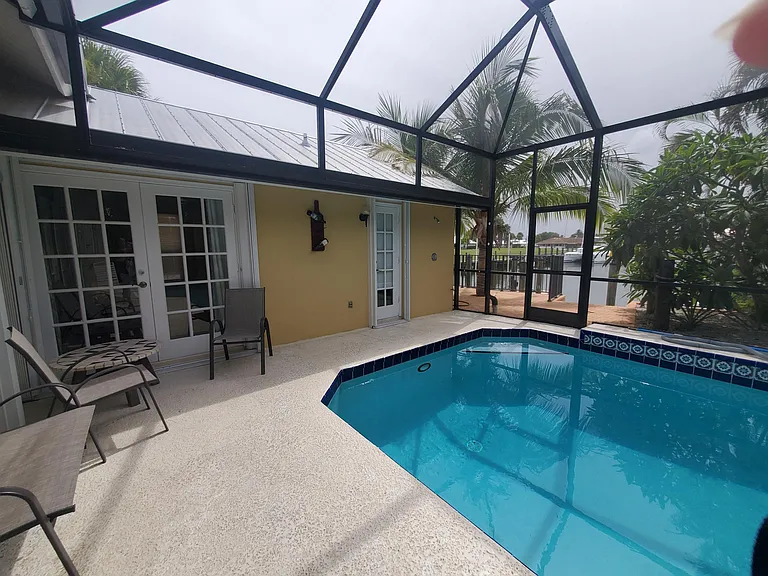 pool, lanai, with a view of the canal