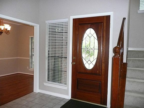 REFINISHED MAHOGANY  FRONT DOOR WITH OVAL GLASS PANE INSERTS