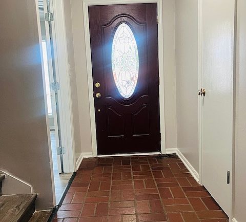 Large entryway with coat closet.