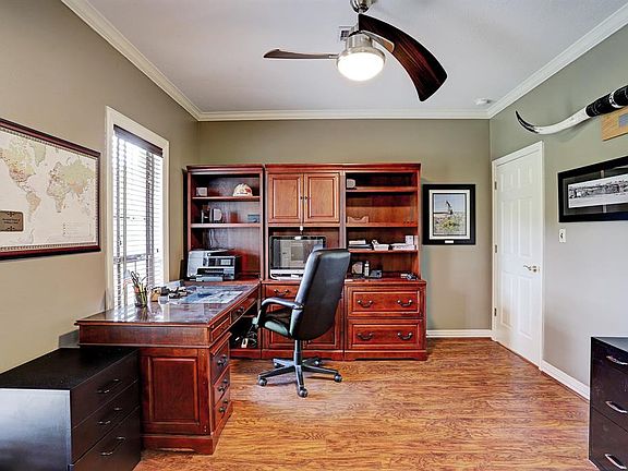 Great study at the front of the home with french doors, wood floors, upgraded fan, and windows for great lighting! This room also features crown molding.
