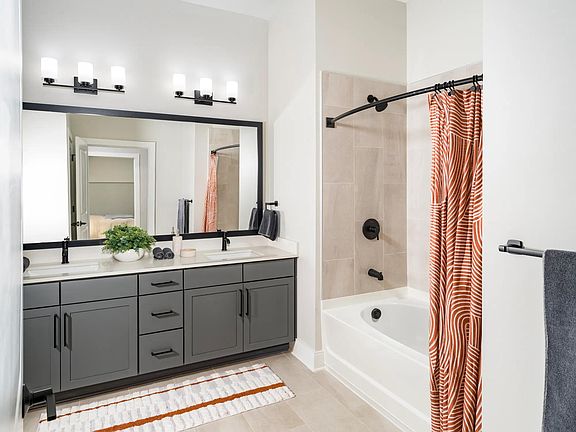 Sophisticated bathrooms at Modera Liberty Row feature dual vanities, sleek finishes, and spacious layouts designed for comfort in Charlotte.