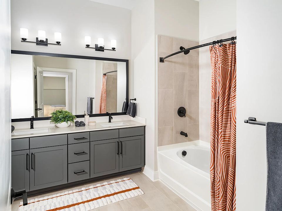 Sophisticated bathrooms at Modera Liberty Row feature dual vanities, sleek finishes, and spacious layouts designed for comfort in Charlotte.