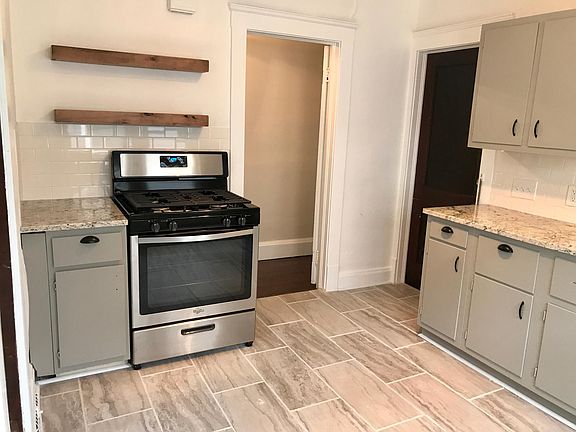 Custom Open Shelves, Ceramic Tile Floor & Brand New Stainles